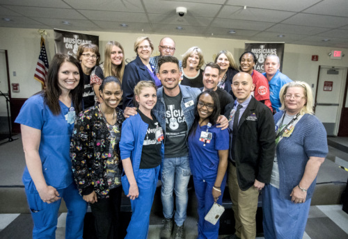 Caregivers pose with Michael Ray during the Las Vegas MOC Bedside Launch