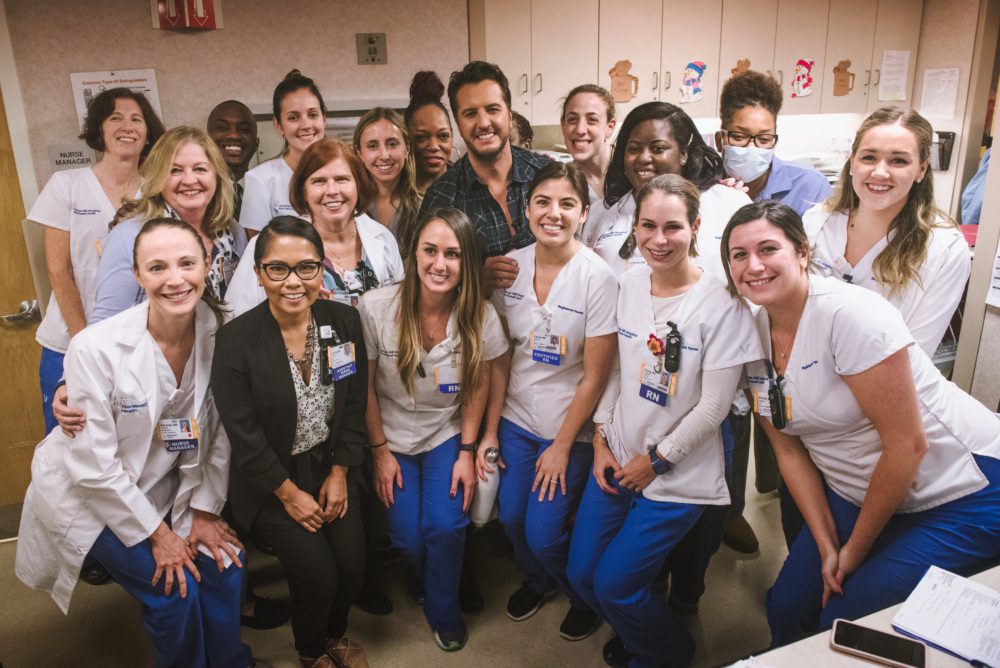 Luke Bryan poses with nursing staff at Lenox Hill hospital in New York City