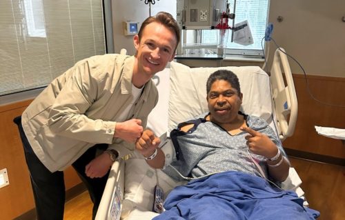 Luke Burr posing with hospital patient