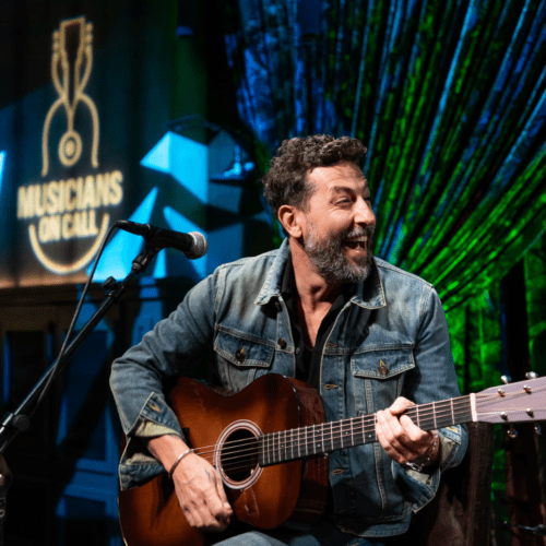 Matthew Ramsey smiles on stage