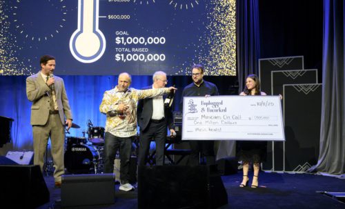 Photo of check presentation at Unplugged & Uncorked