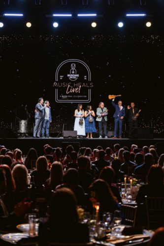 Charles Esten, Michael Solomon and Volunteer Honorees at Musicians On Call's Music Heals Live! at The Pinnacle in Nashville on May 20, 2026 (Photo credit: Heather Durham)