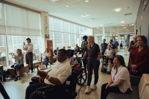 Patients and caregivers at Jefferson Moss-Magee Rehabilitation enjoy a performance from Musicians On Call