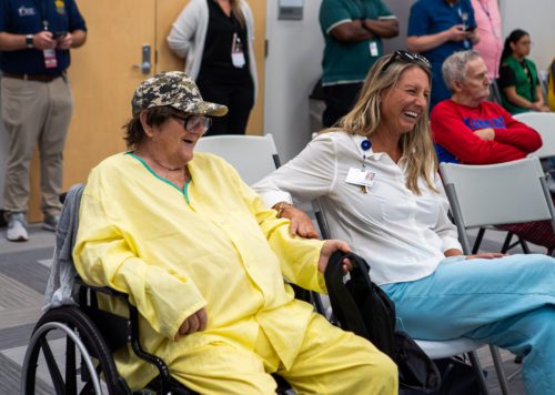 Photo of Veteran and nurse laughing