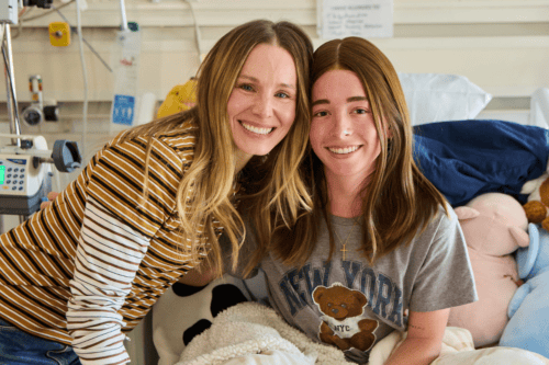 Photo of Kristen Bell posing with a hospital patient